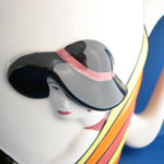 raised decoration of Art Deco lady with black hat and red lipstick