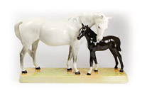 Beswick Ceramic Model 1811 showing a White Mare and Black Foal on a plinth
