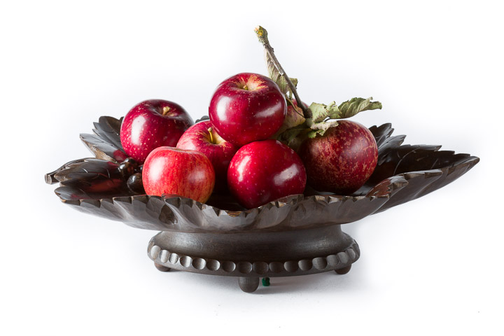 Black Forest Musical Fruit Bowl filled with red apples carved as a vine leaf from beechwood