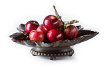 Black Forest Musical Fruit Bowl shaped as a vine leaf carved from beechwood and filled with deep red shiny apples