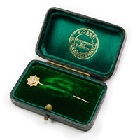Antique gold tie stick pin with diamond chip and chester gold hallmark in green velvet presentation case by jeweller X.Ganz of 231 High Street, Swansea
