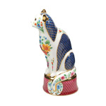 side view of white porcelain cat candle snuffer showing deep blue panels of a Worcester ‘scale’ pattern