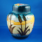 high gloss moorcroft glaze brown reeds against yellow golden sunset and turquiose sky