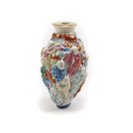 Very high relief mouldings of eighteen Luohan can be seen enamelled in famille rose quianlong palette