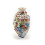 With the carved and moulded porcelain snuff bottle Taming Tiger Lohan Pindola can be seen riding a ferocious tiger with his precious ring held high and lighted in gilt