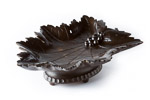 Rich dark brown patina black forest carving of a vine leaf with carved details of veins, branch and grapes