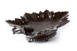 hand carved from beechwood with rich dark stain and detail of vine leaf and carved branch and grapes