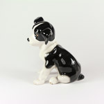 Side view of spaniel puppy pottery figurine