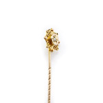 antique stick pin with nautical rope grommet rings applied in gold and reflecting light on Star of Lakshmi base