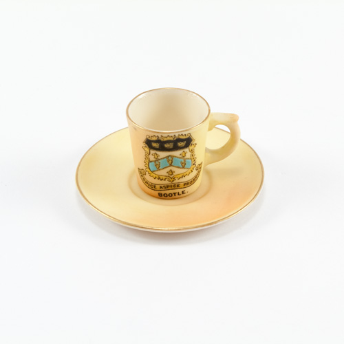 Locke & Co miniature porcelain cup and saucer in blush ivory with gilding to the rim