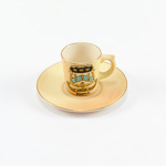 Locke & Co miniature blush ivory cup and saucer with bootle crest