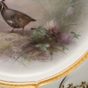 Signature of artist S.Wilson in gold below game bird rural scene on Doulton Plate