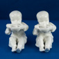 Pair of white seated unpainted model 3073