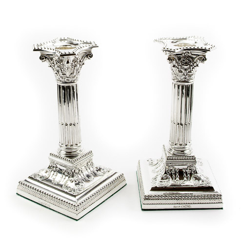 Pair of James Dixon and Sons solid silver candlesticks